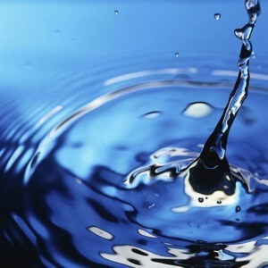 A water droplet dropping into more water.