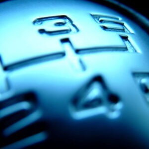 A close-up of the shift stick in a vehicle.