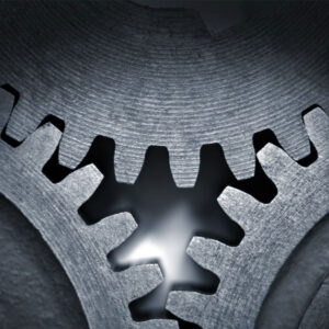 An image of gears, interconnected.
