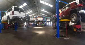 An image of the entire shop with raised cars.