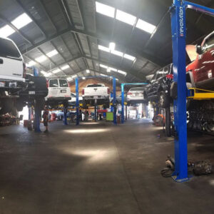 An image of the entire shop with raised cars.