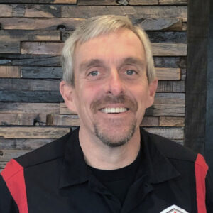 A man with blond hair. that is a Ralph's technician.