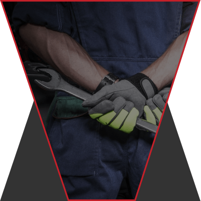 An image of a mechanic with their arms crossed neatly behind their back.