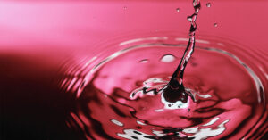 An image of a drop plopping into water.