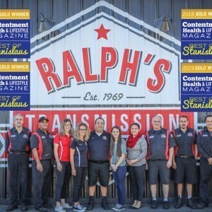 The crew of the Ralph's Transmission shop in front of the building.