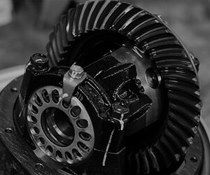 A black and white photo of vehicle components.
