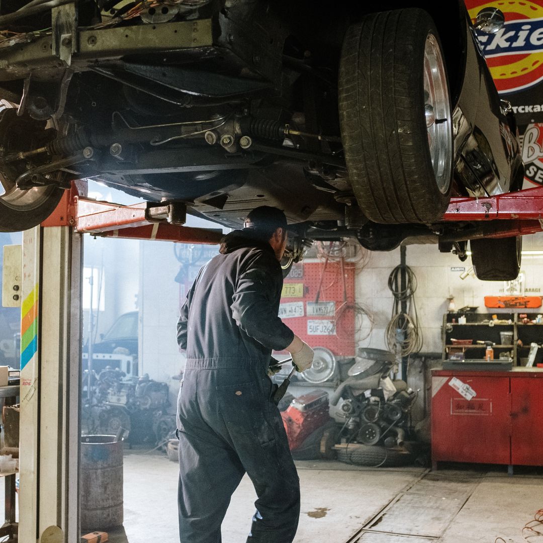 Mechanic working underneath a car