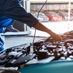 mechanic looking at a car